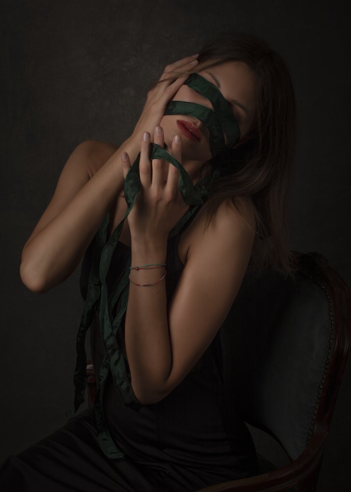 Pensive Blindfolded Woman