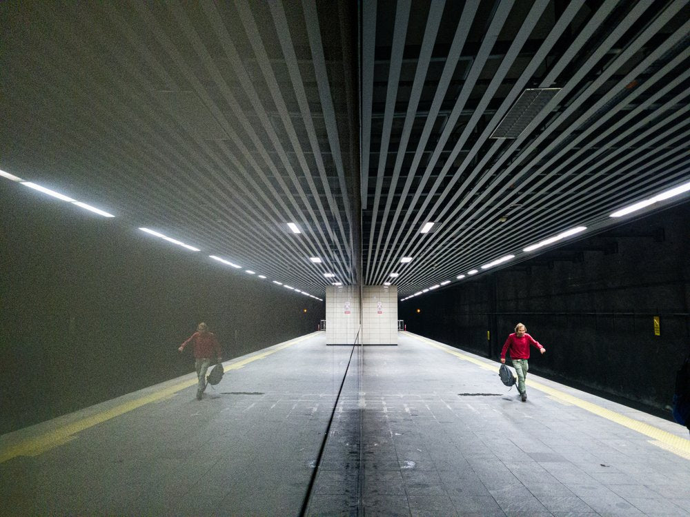 Lone Figure Metro Reflection
