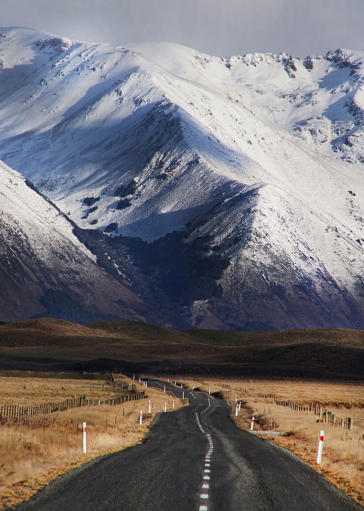 Winding Road Snowy Peaks