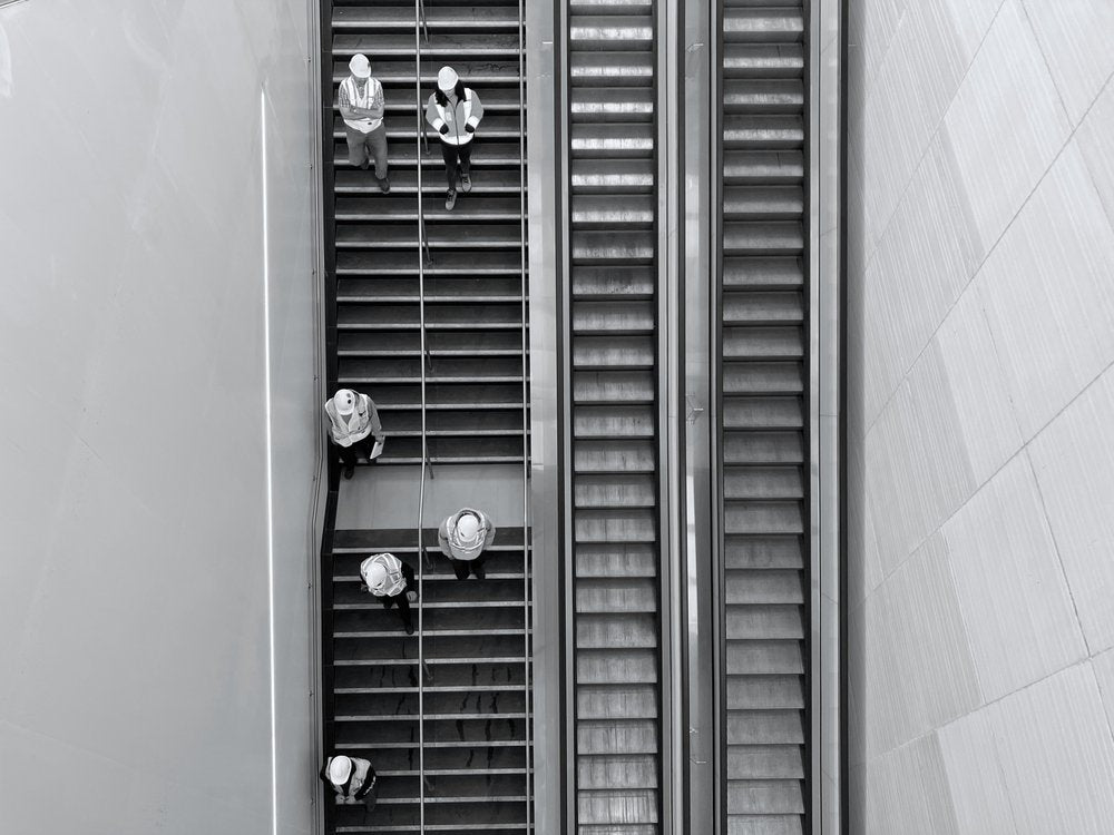 Hard Hats on Modern Stairs