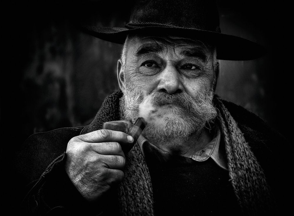 Pensive Man Smoking Pipe