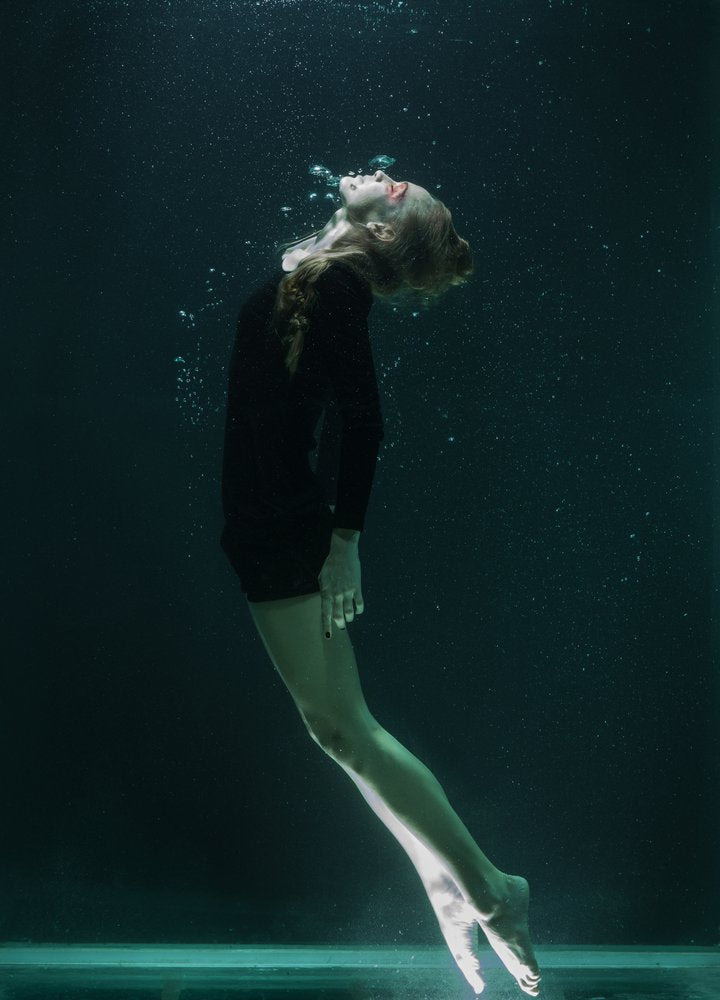 Woman Floating Underwater