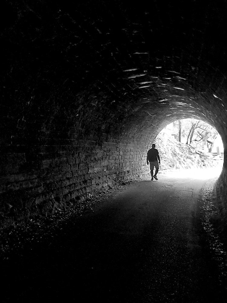 Man Walks Towards Light