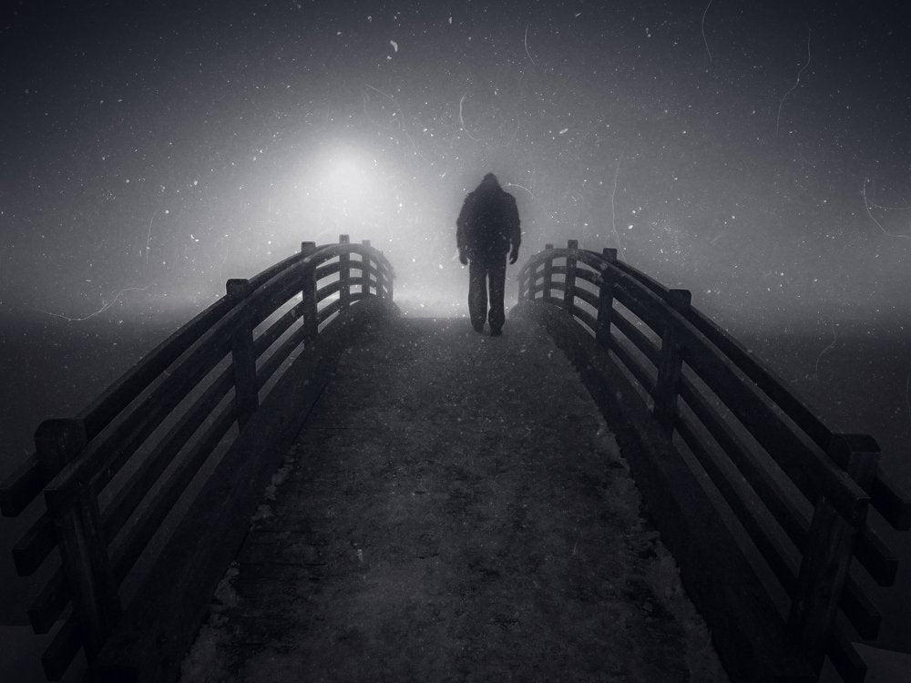 Man on Foggy Bridge