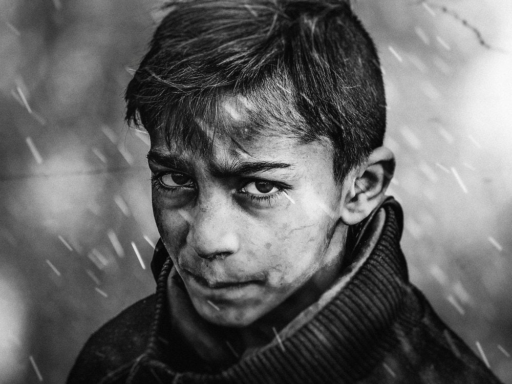 Young Boy's Rainy Gaze