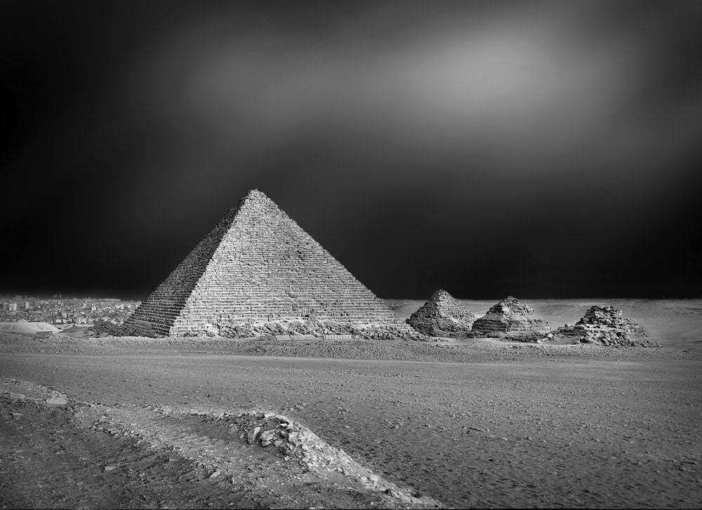 Pyramids Under Dark Sky