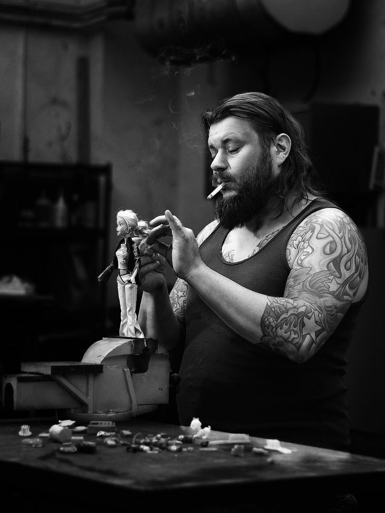 Smoking Craftsman and Doll