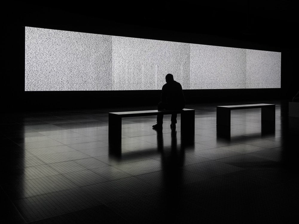 Man Before Static Screen