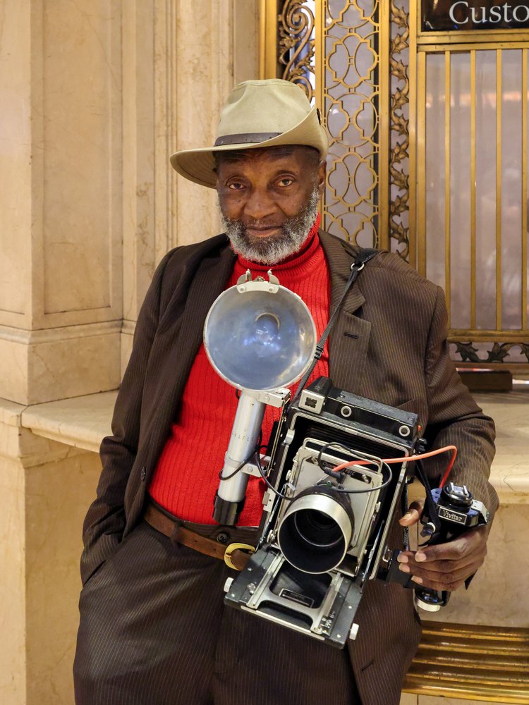 Dapper Man With Camera