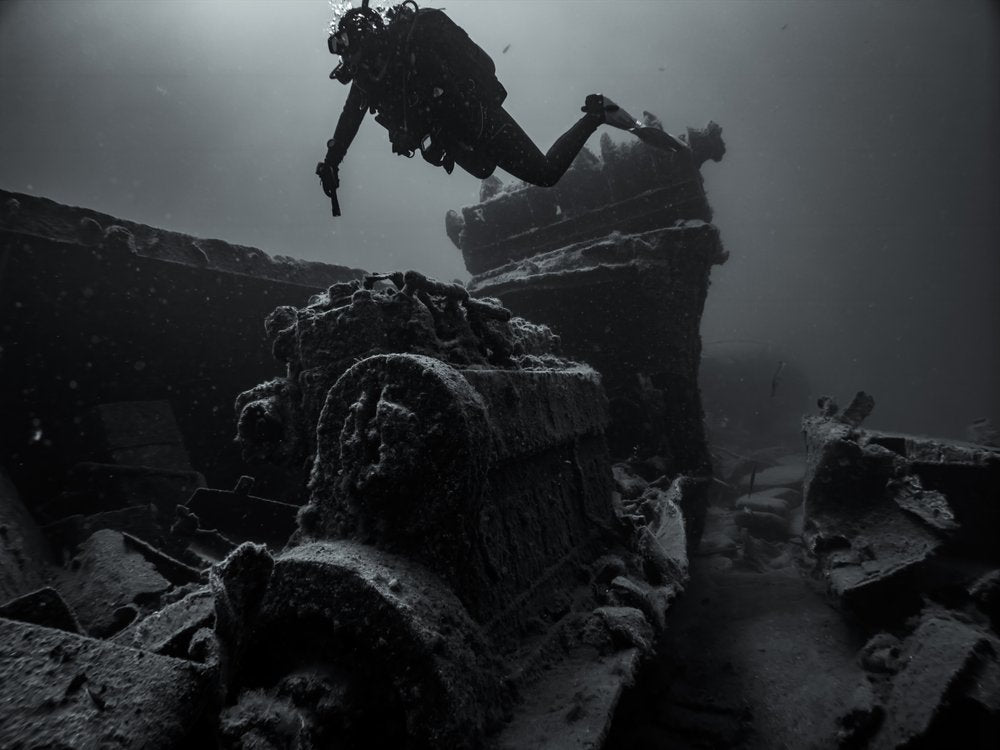 Diver Explores Shipwreck