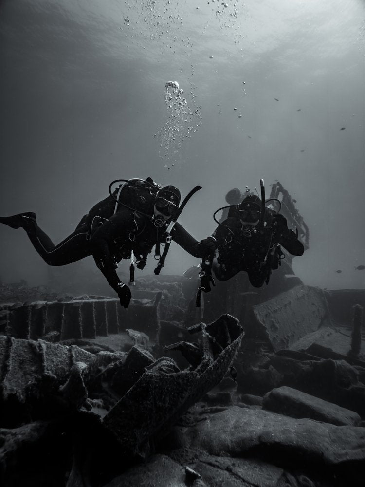 Divers Explore Sunken Ruins
