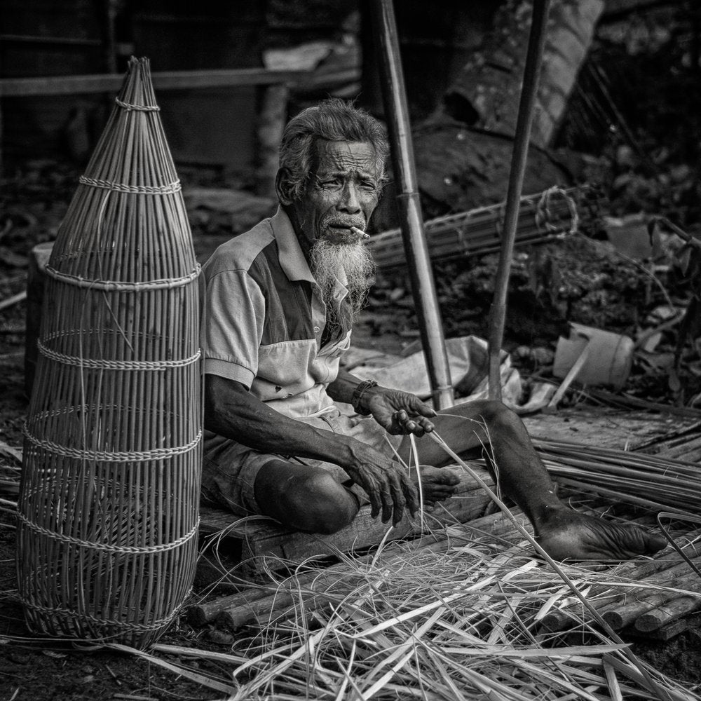 Elder Craftsman Weaving Bamboo