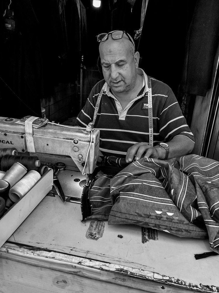 Focused Tailor at Work
