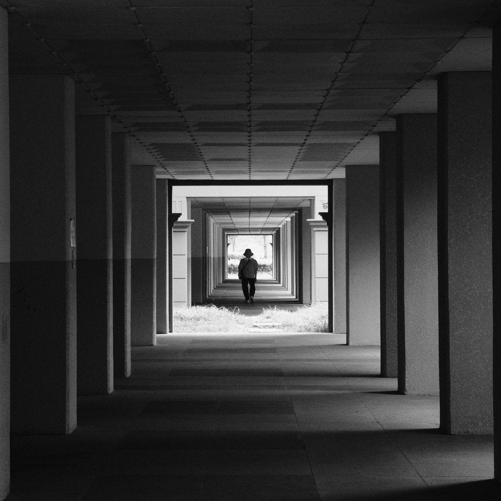 Man Walking Into Light