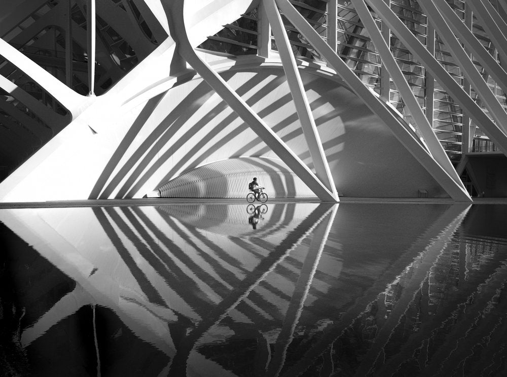Cyclist Reflects Modern Architecture