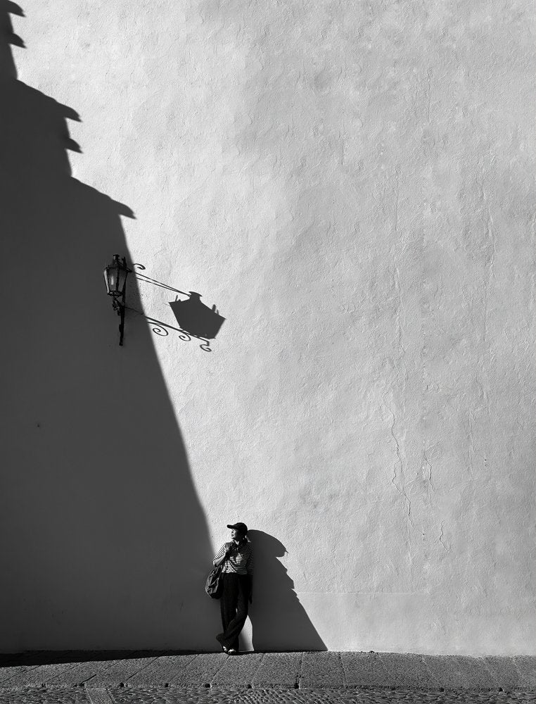 Woman by Shadowed Wall