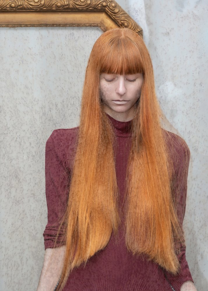 Pensive Red Haired Woman