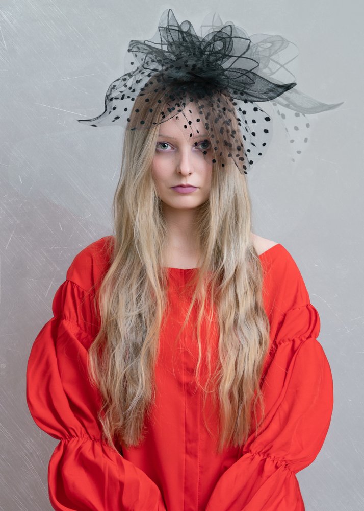 Elegant Blonde Fascinator Portrait