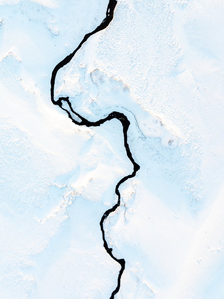 Winding River Through Snow