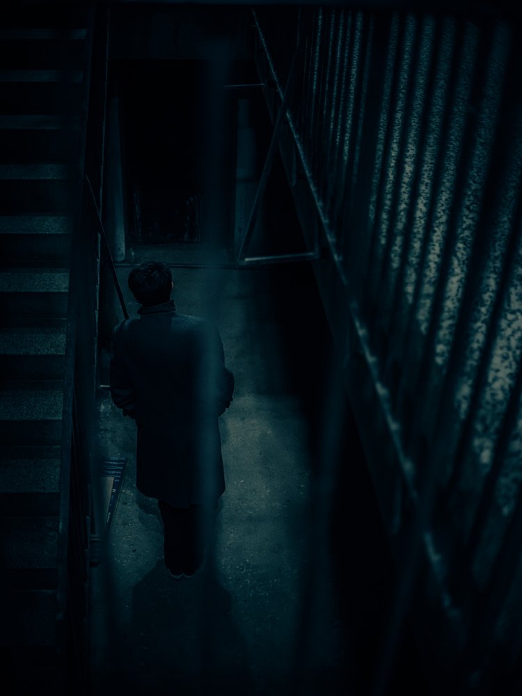 Man In Dark Stairwell