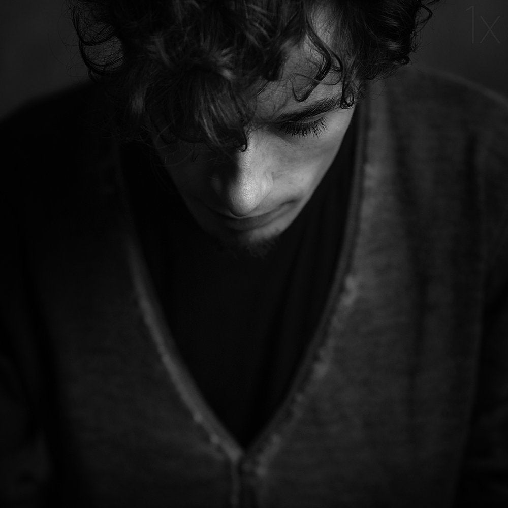Thoughtful Man Looking Down