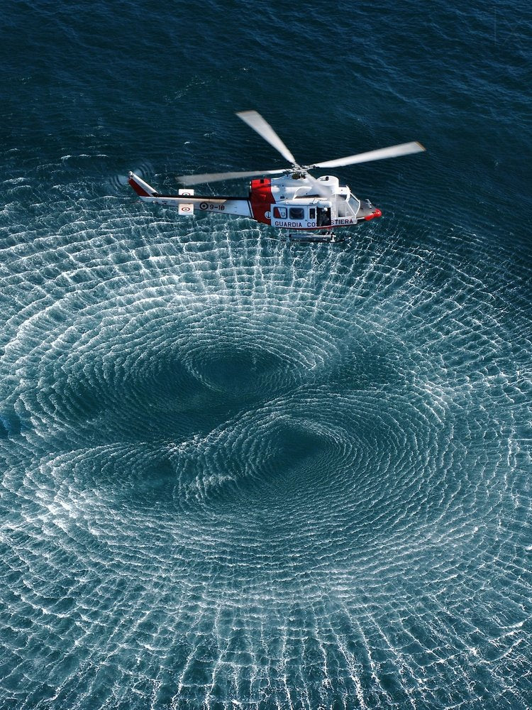 Helicopter Over Swirling Ocean