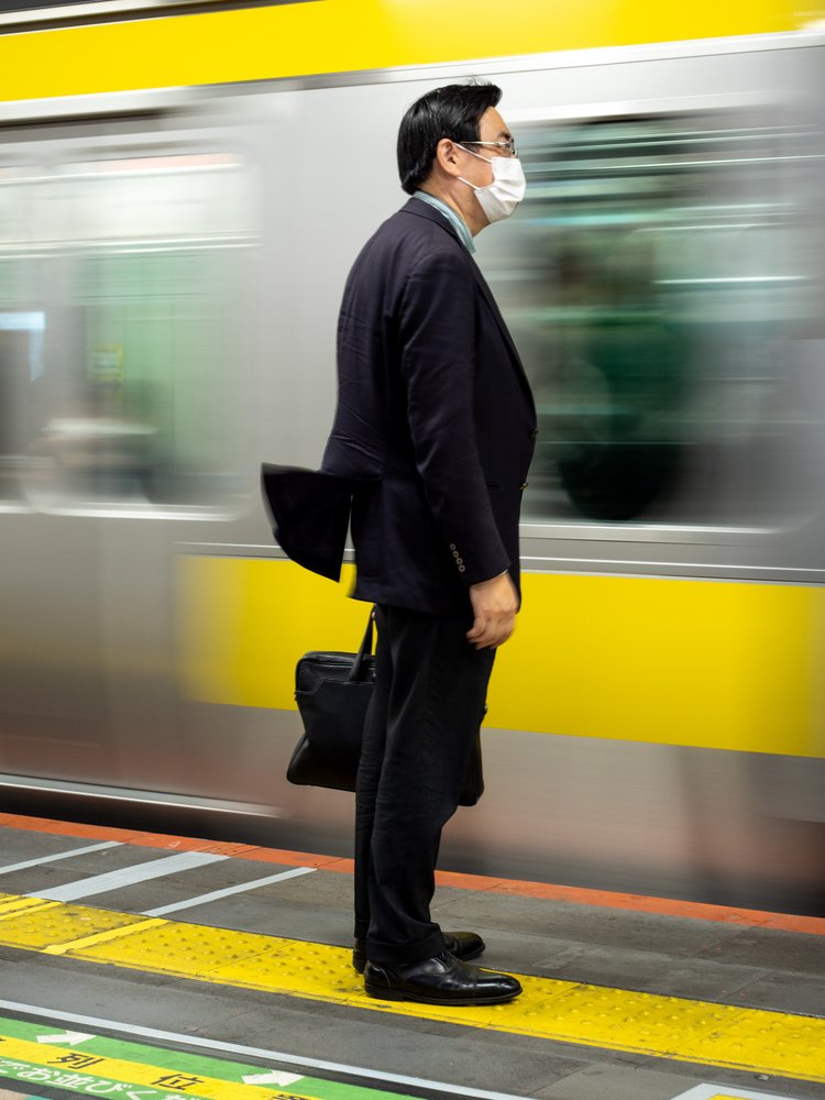 Commuter Awaits Train