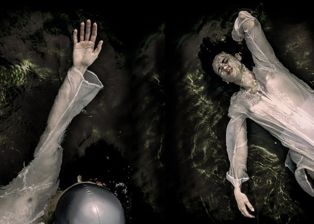 Woman Submerged Dark Water