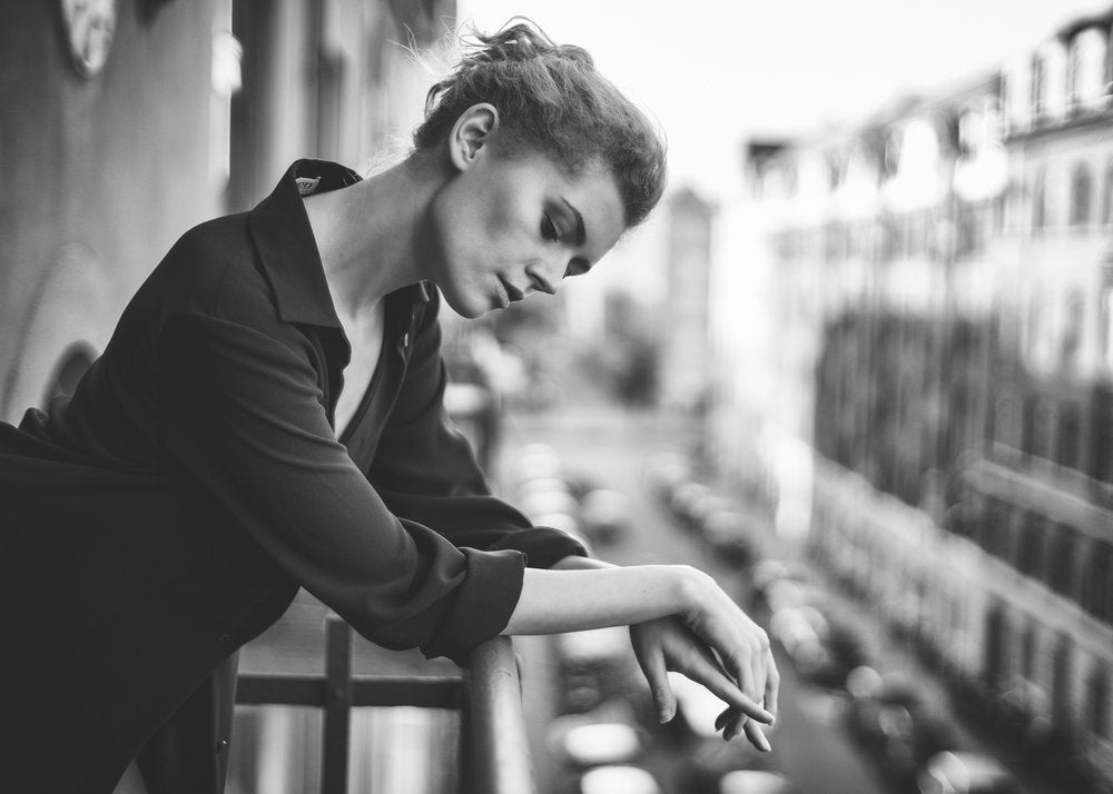 Pensive Woman City Balcony
