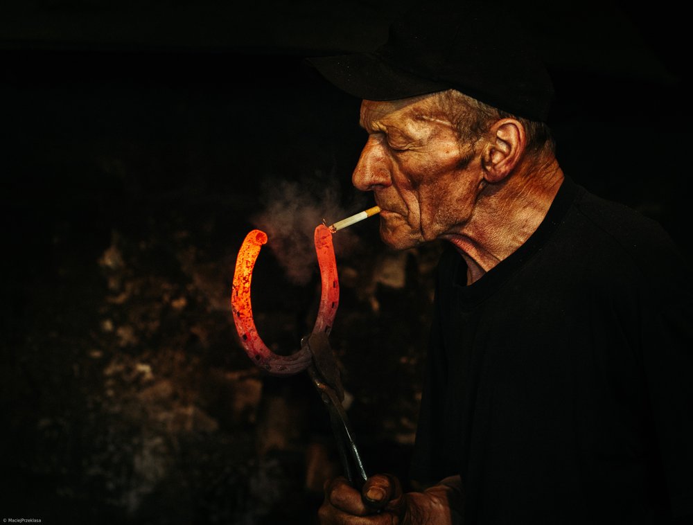 Blacksmith Lights Cigarette