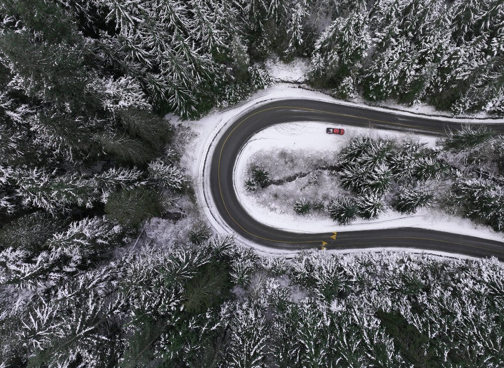 Winding Snowy Forest Road
