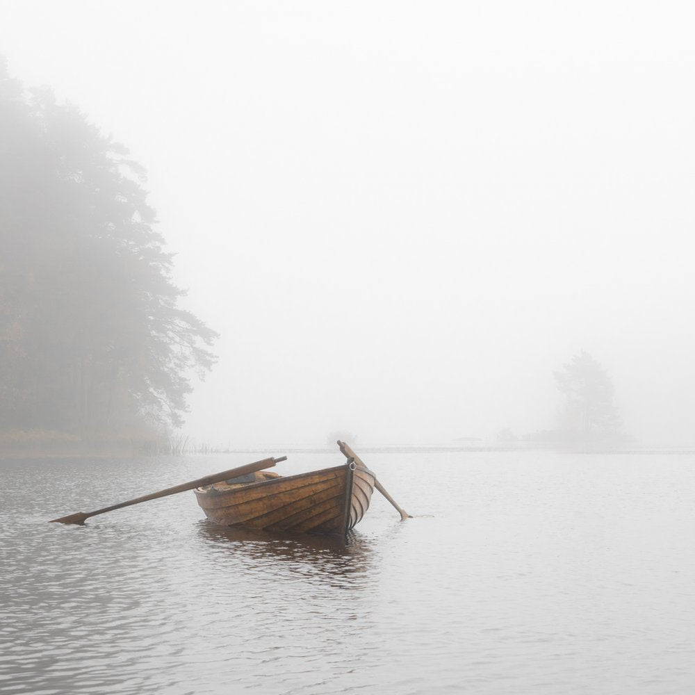 Rowboat in Misty Waters