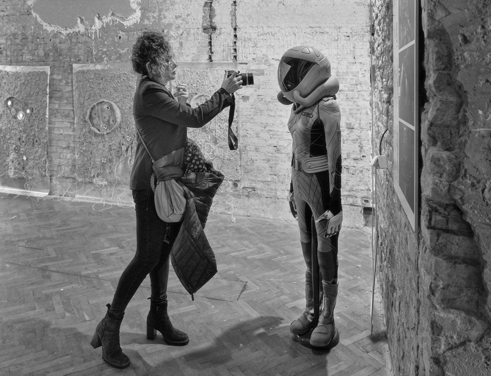 Woman Photographs Space Suit