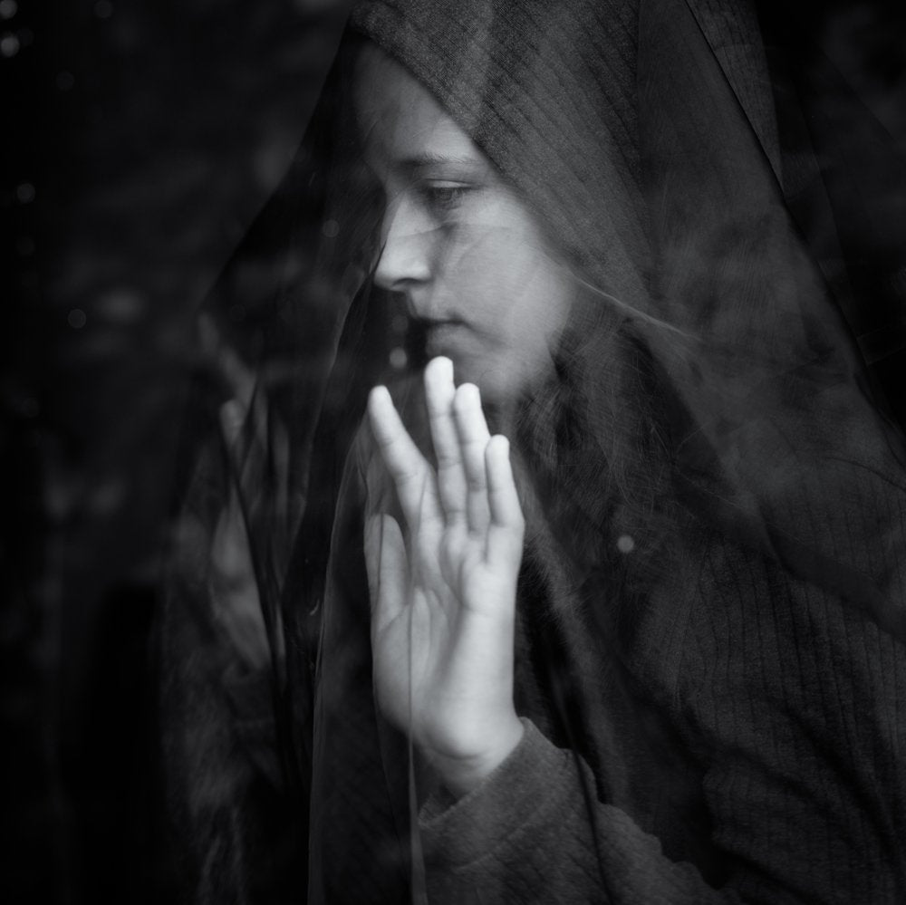 Pensive Hooded Woman