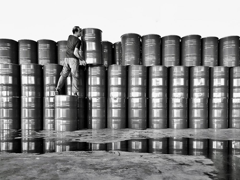 Worker Stacking Barrels