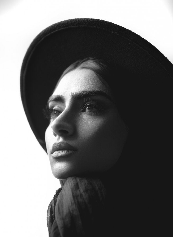 Pensive Woman In Hat