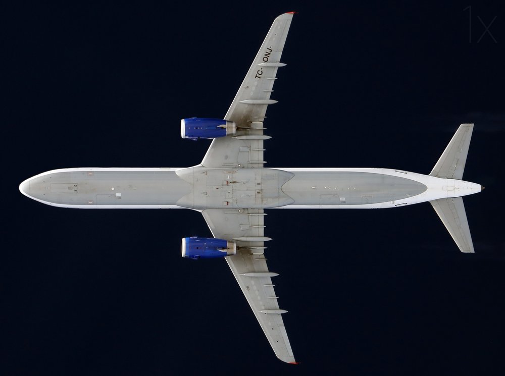 Sleek Jet Overhead