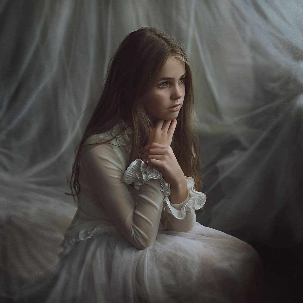 Thoughtful Girl in White