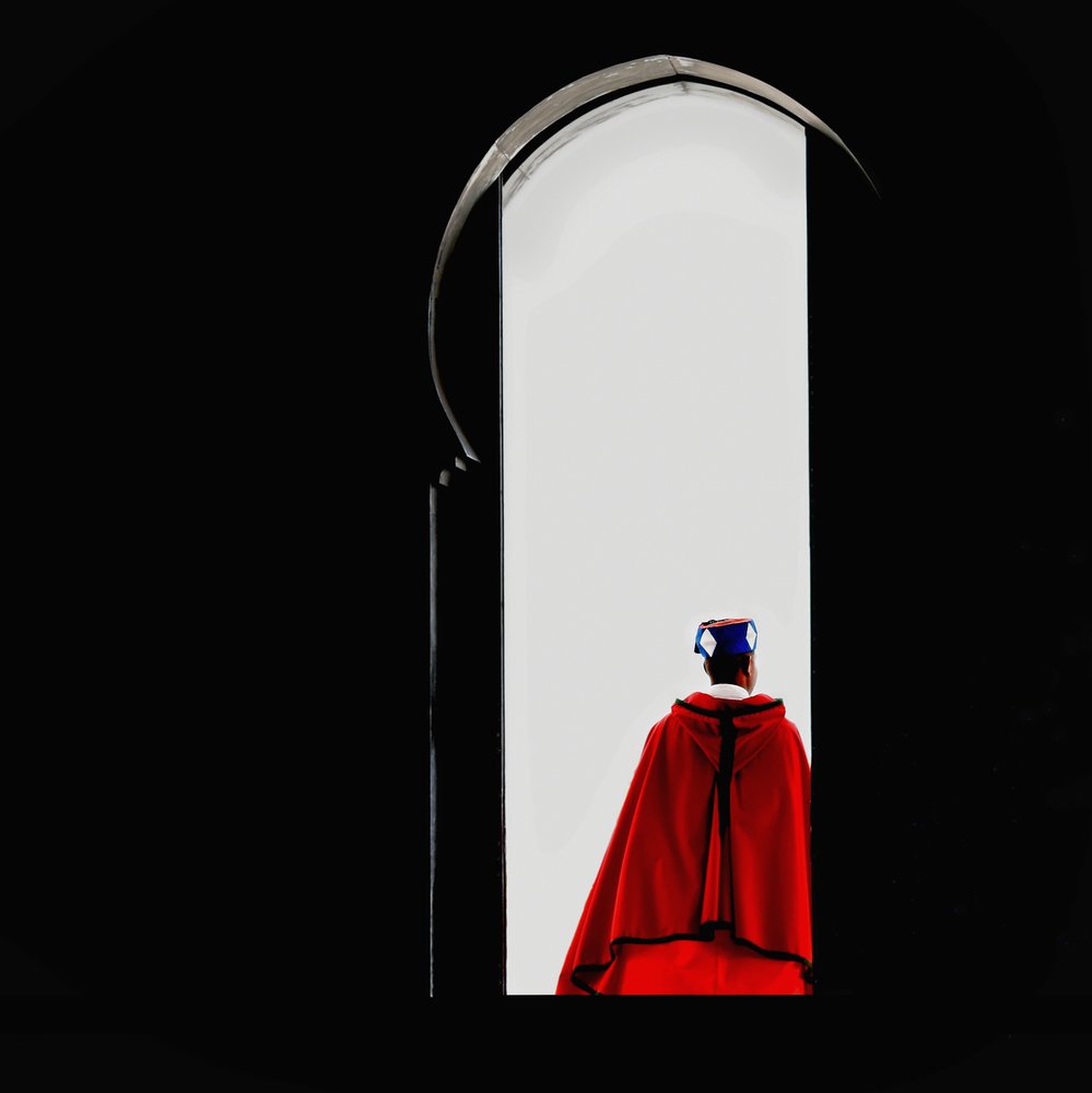 Man In Red Archway