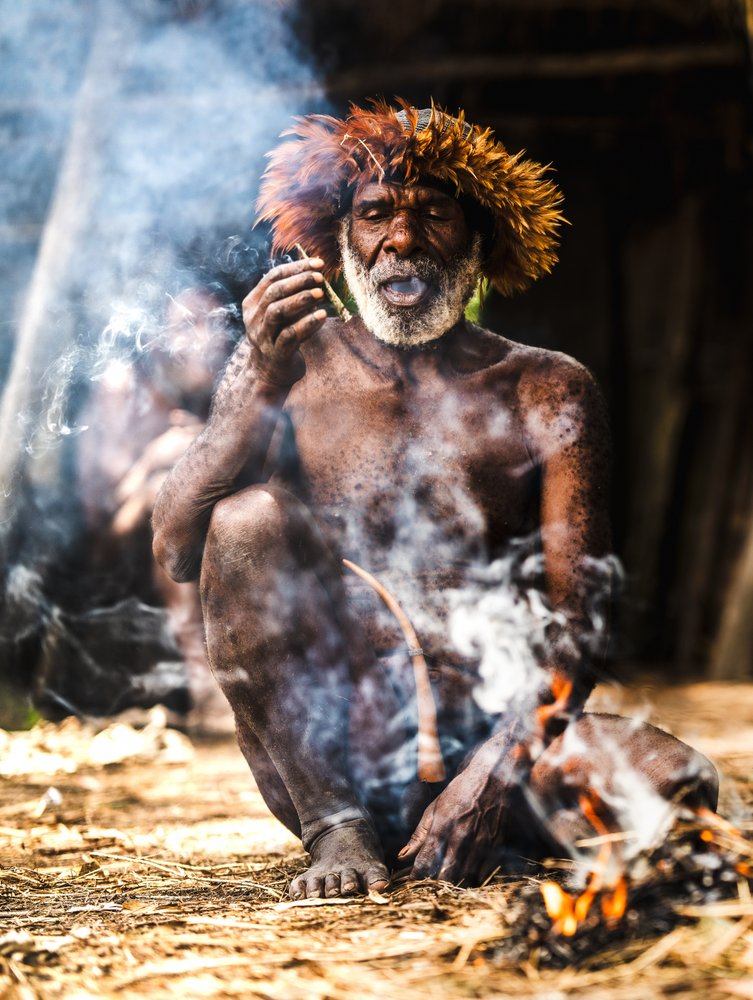 Tribal Elder Smoking Fire