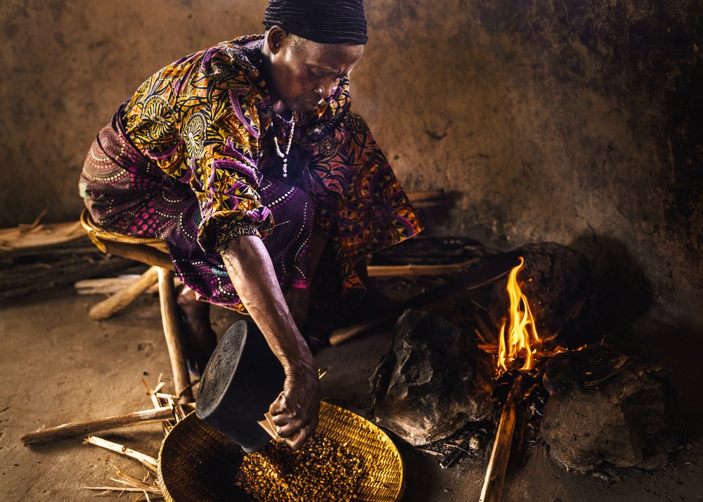 African Woman Cooking Fire