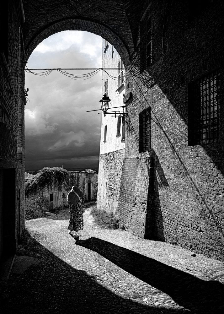 Solitary Figure Archway Shadows