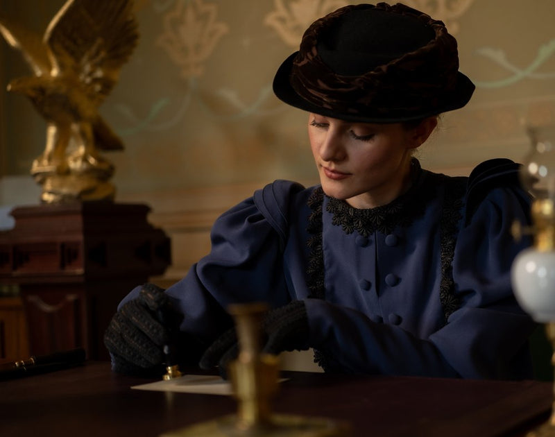 Elegant Woman Sealing Letter
