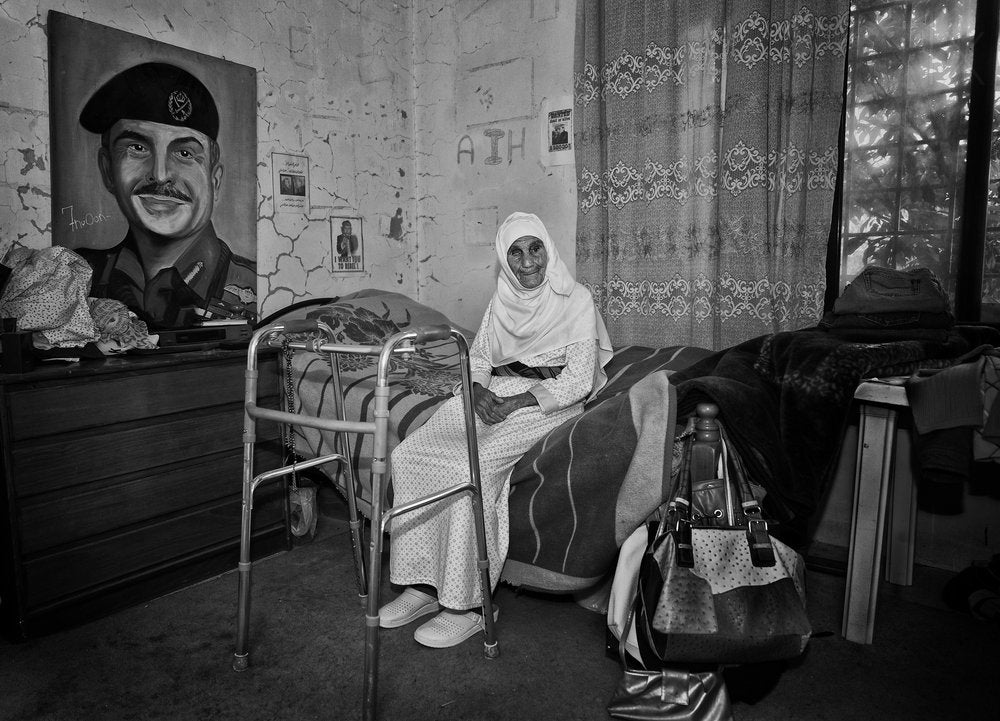 Elderly Woman And Portrait