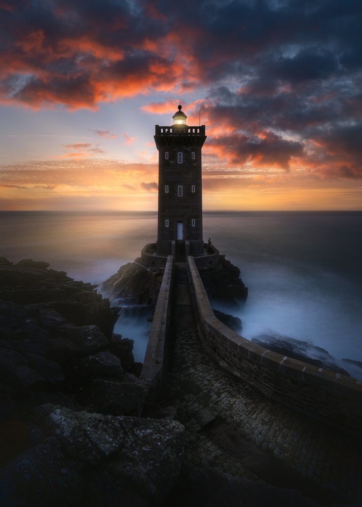 Misty Lighthouse Sunset
