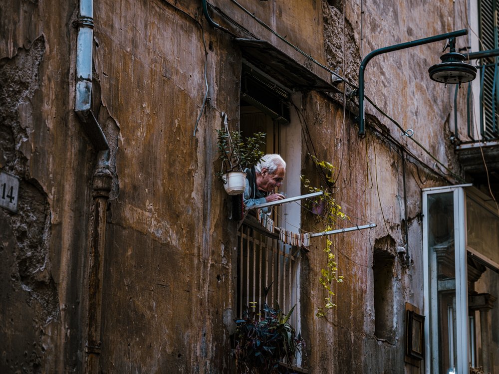 Old Man On Balcony