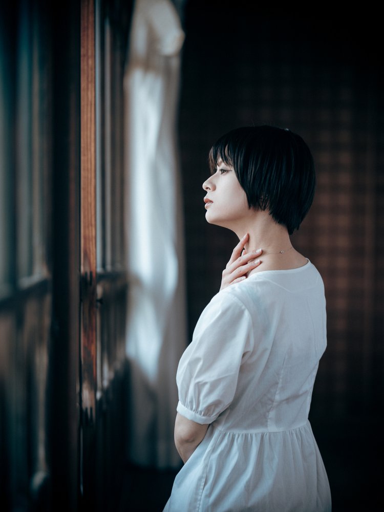 Thoughtful Woman By Window