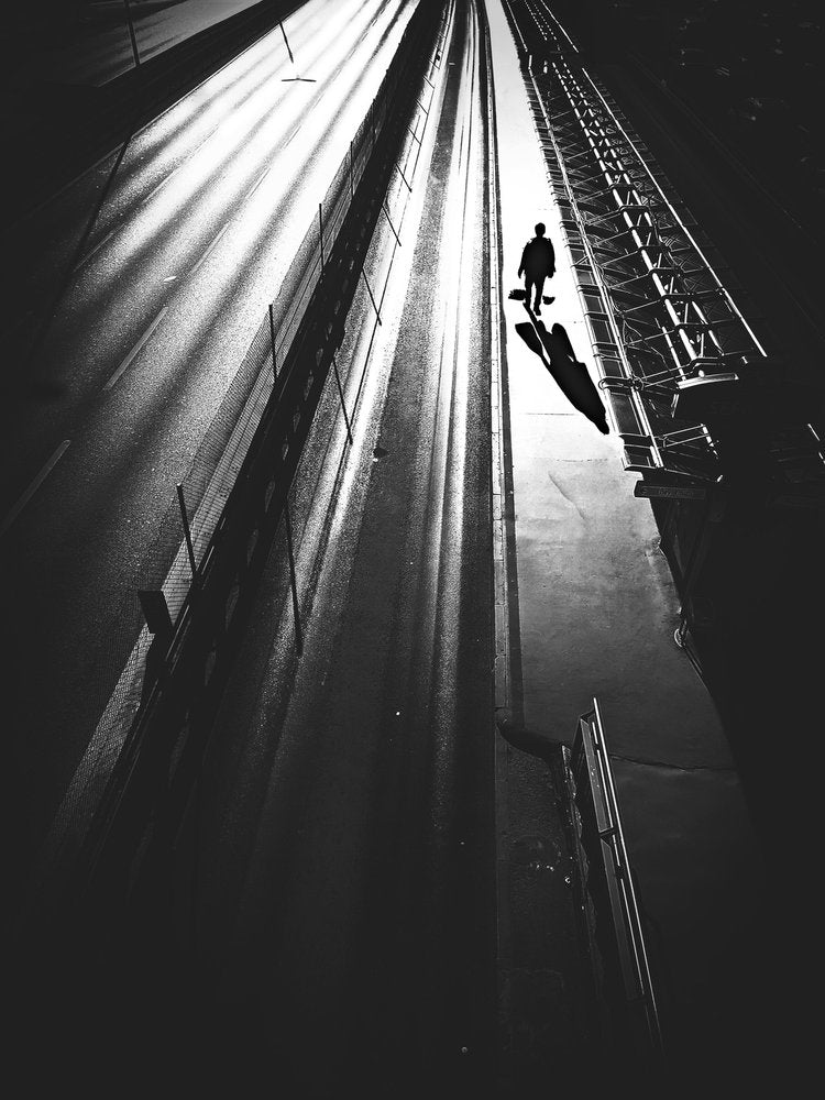 Man Walking Long Shadows