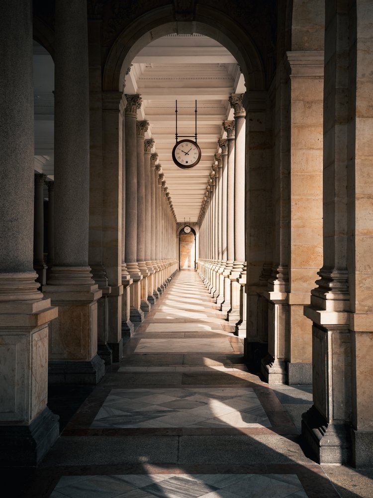 Arched Hallway With Clock