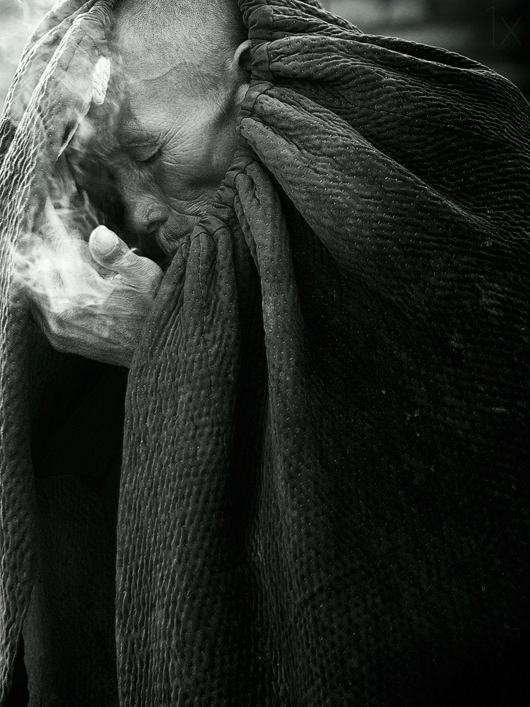 Pensive Elder With Smoke